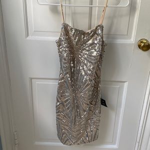 “Lost In Your Eyes Silver Sequin Bodycon Mini Dress” from Lulus.